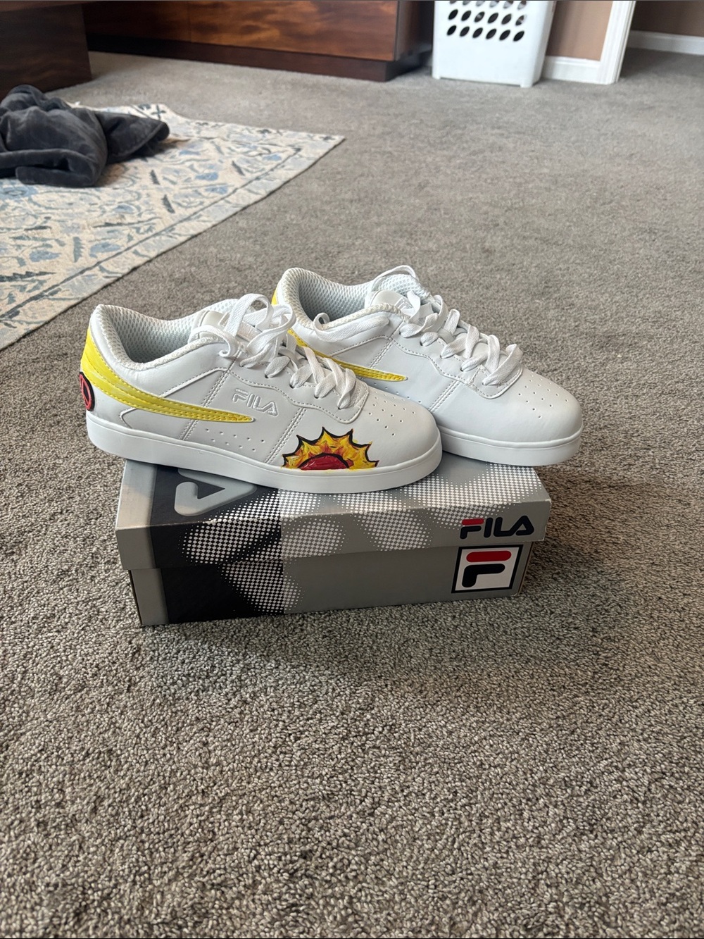 Fila Kids White Sneakers with Yellow Trim and Red Sunburst